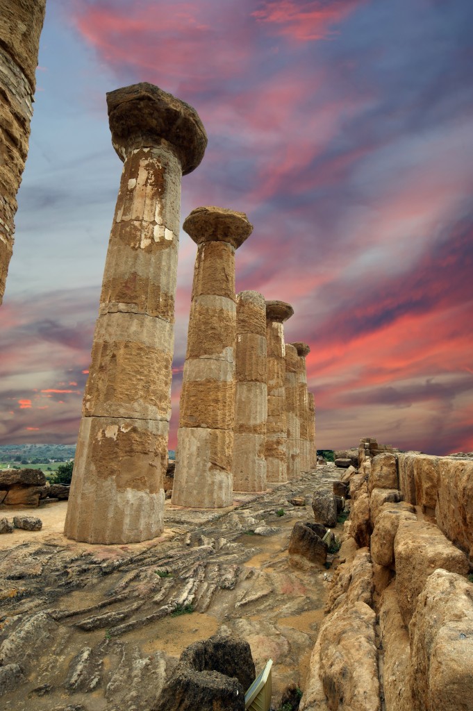 Remains of an ancient Greek temple of Heracles (V-VI century BC), Valley of the Temples, Agrigento, Sicily. The area was included in the UNESCO Heritage Site list in 1997